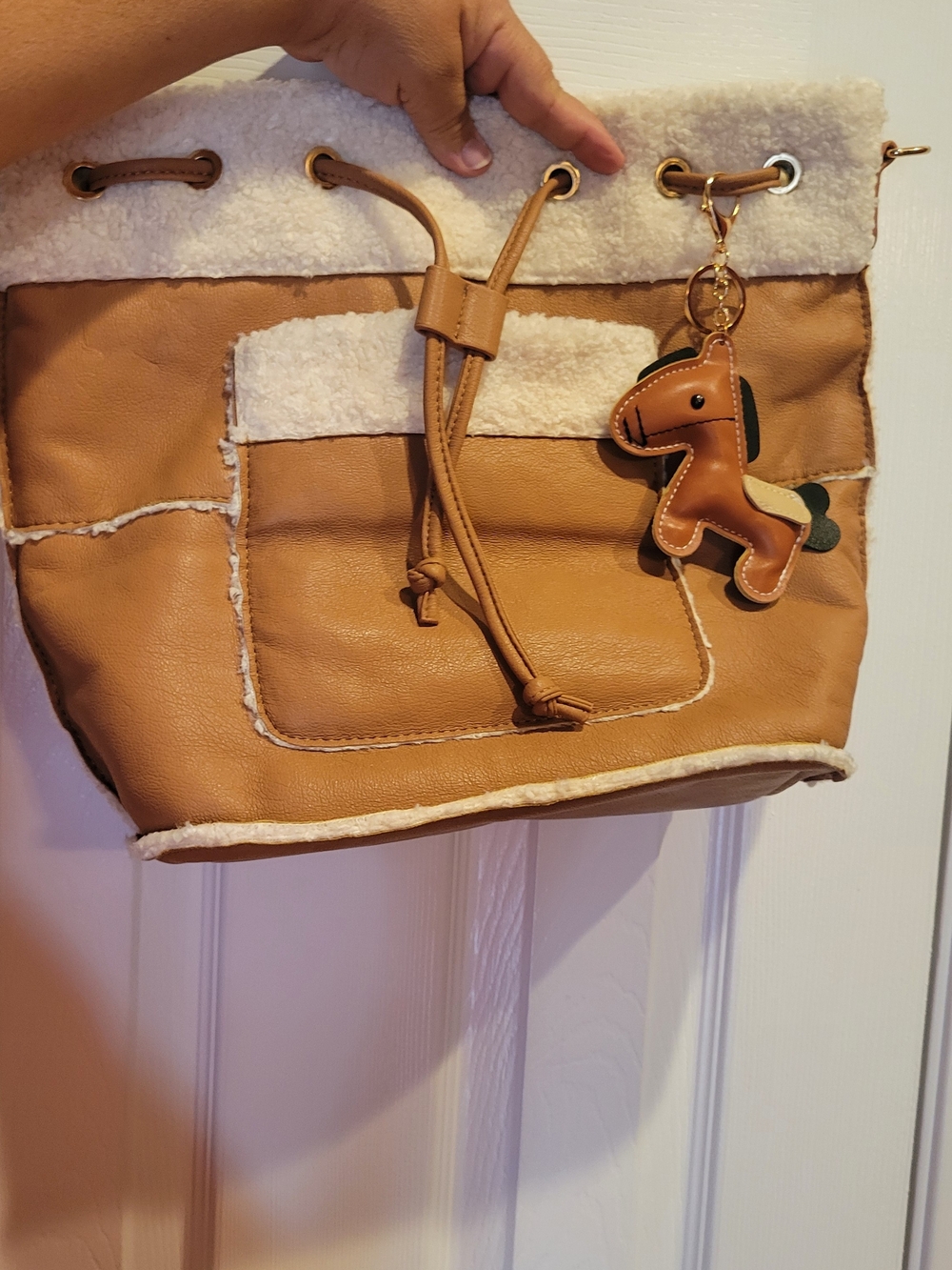 Tan Faux-Shearling Drawstring Bucket Bag with Charm